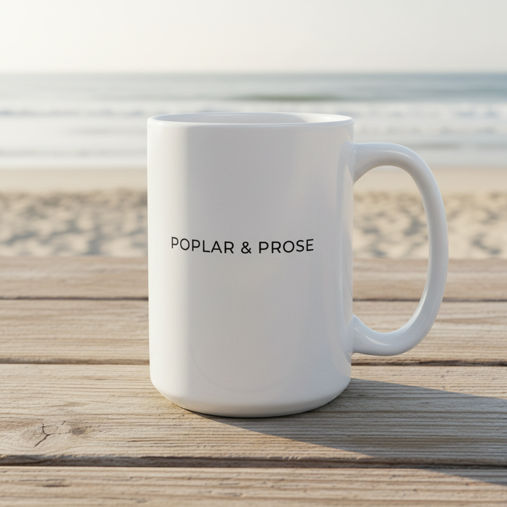 White mug with 'Poplar & Prose' text on a wooden surface in 15 oz