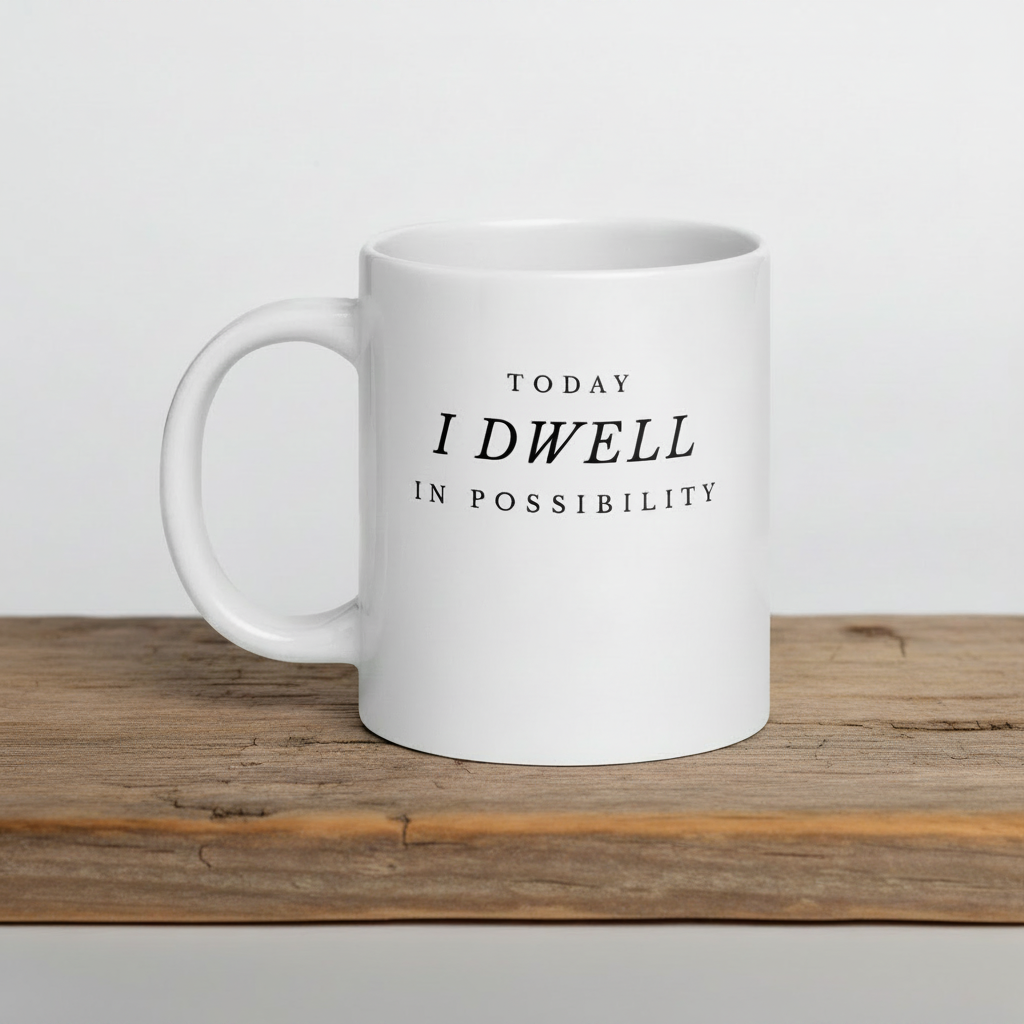 White mug with text 'TODAY I DWELL IN POSSIBILITY' on a wooden surface in 20 oz