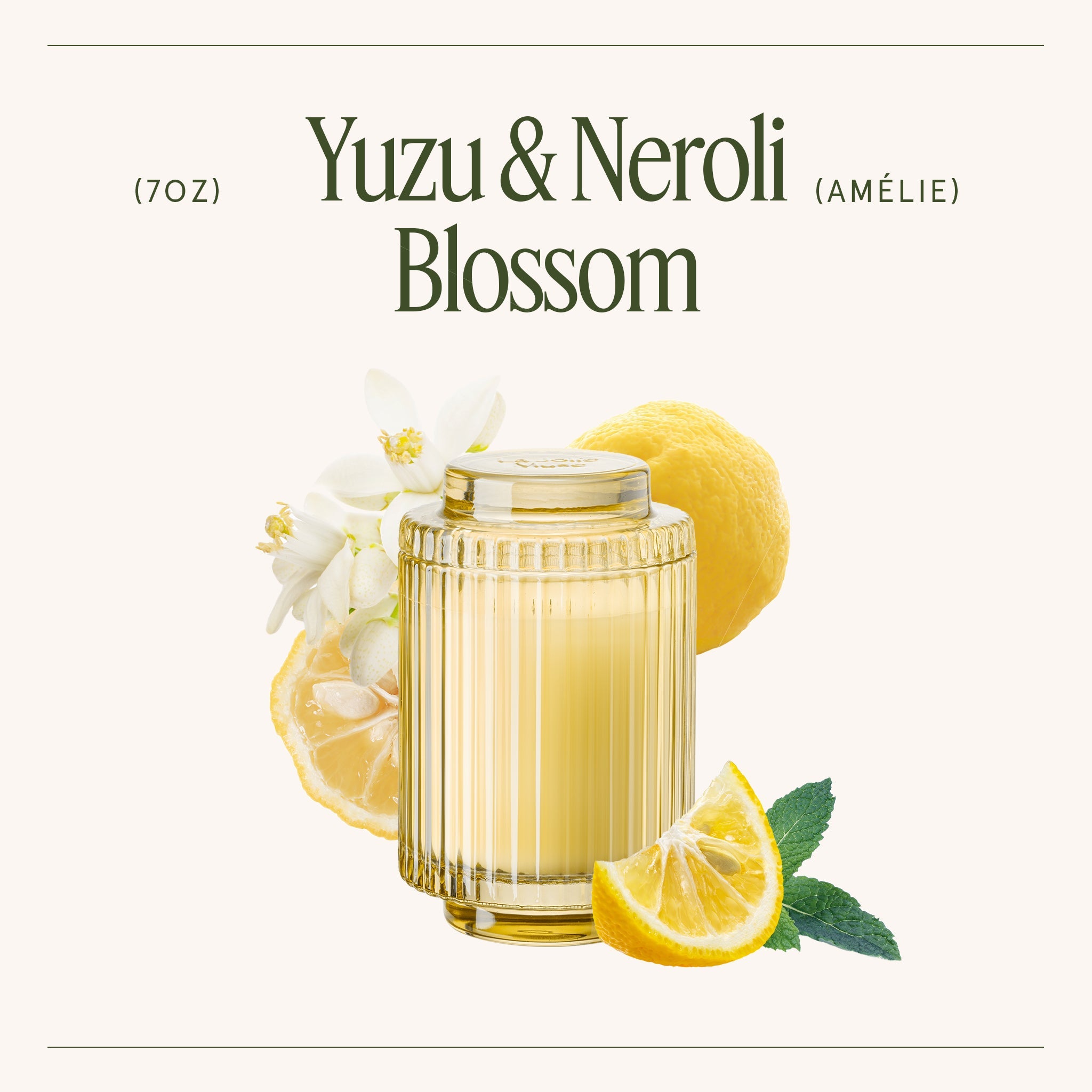 Glass of Yuzu & Neroli Blossom with lemons and flowers on a white background