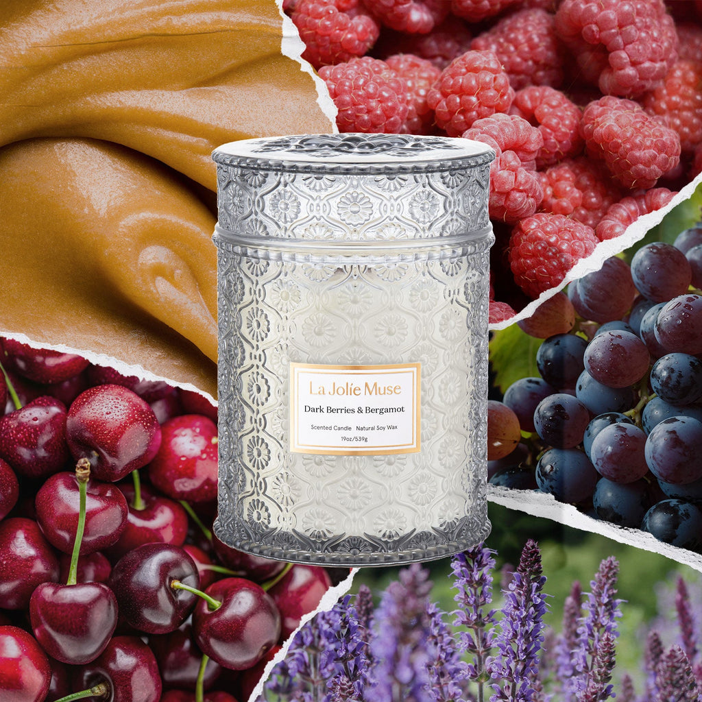 Decorative candle with fruit and floral elements in the background
