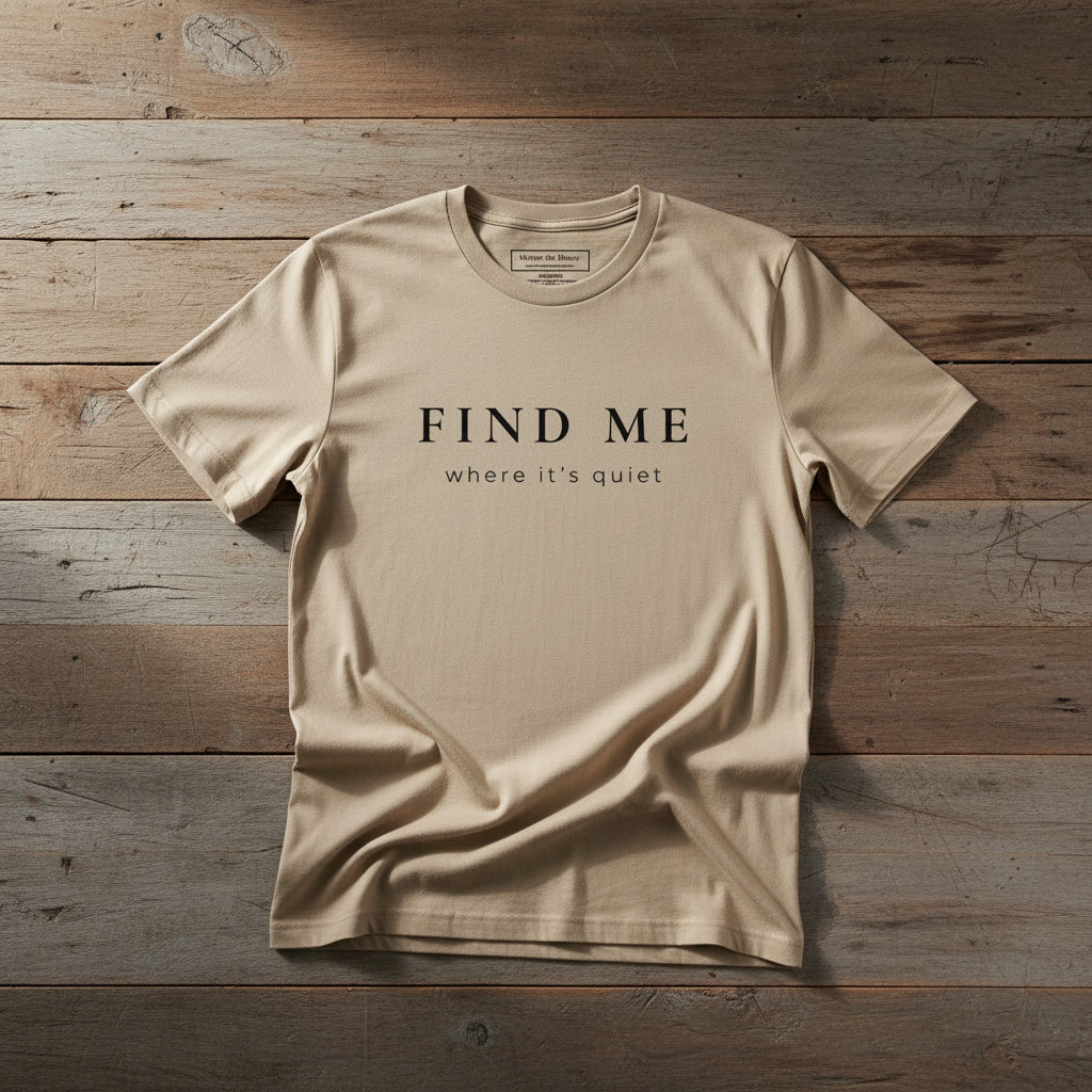 Beige Find Me Organic Tee on light reclaimed wood surface