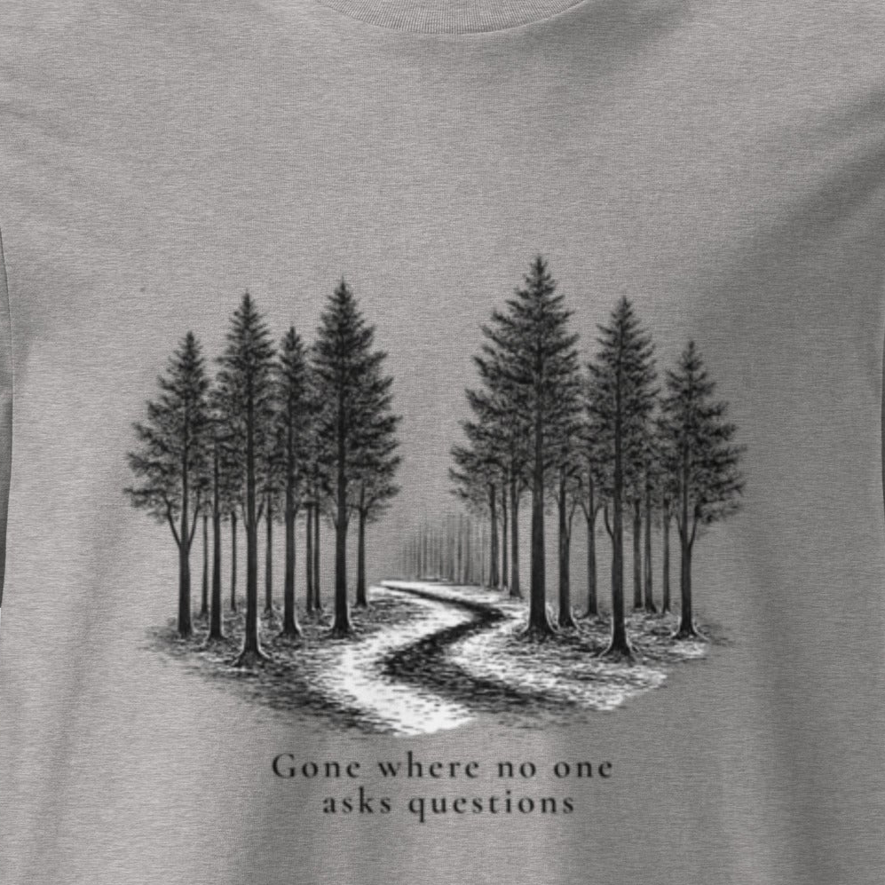 Gray t-shirt with a black and white illustration of a forest path and trees, with text 'Gone where no one asks questions'.