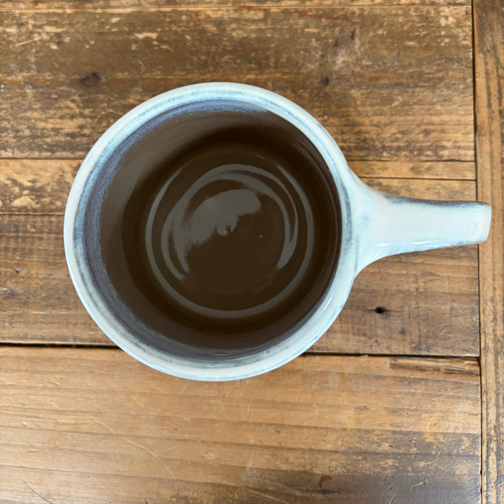 Inside of th Hearth Mug on a wooden table
