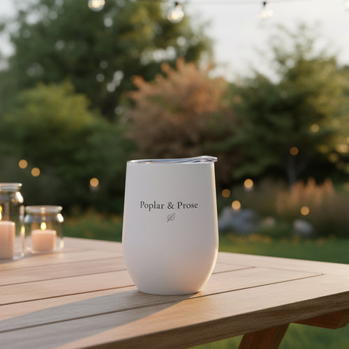 Poplar & Prose logo side of tumbler with lid outdoors in a garden