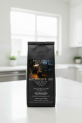 Coffee bag labeled 'Midnight Oil' on a kitchen counter