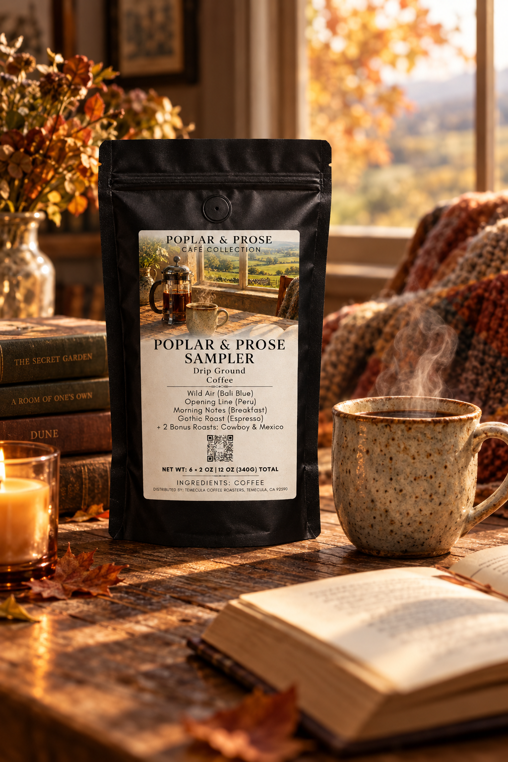 A black stand-up pouch of Poplar & Prose Sampler Hops-Featured malt beverage mix stands on a rustic table in a warm autumn setting. The pouch has a white front label with product details and a small scenic illustration.