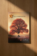  'FALL COMPANION' with a cover featuring a large red autumn tree against a warm sunset sky. 