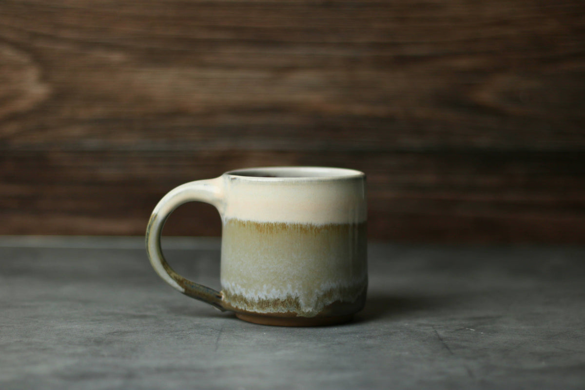 Handcrafted stoneware mug with cream moss, and forest green gradient glaze