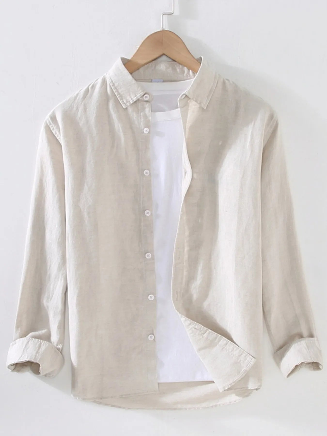 Weekend Cotton + Flax shirt in beige on a wooden hanger with white background