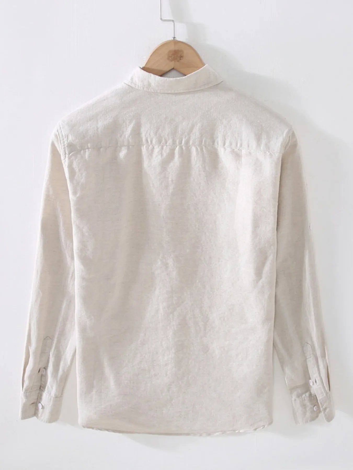 Weekend Cotton + Flax shirt in beige on a wooden hanger with white background, back view