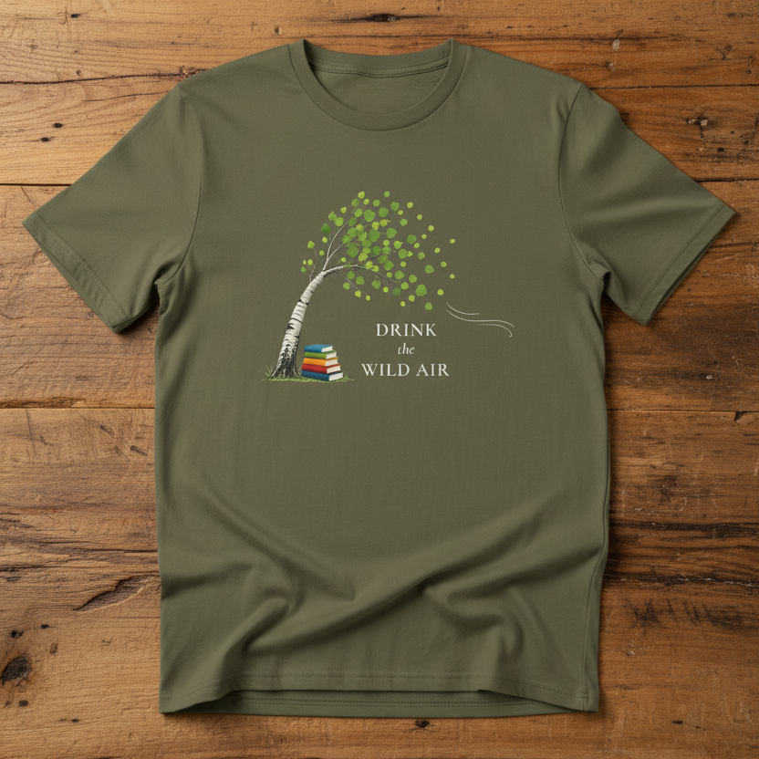 khaki green tee with 'drink the wild air' and tree bent in the wind with stack of books under the tree